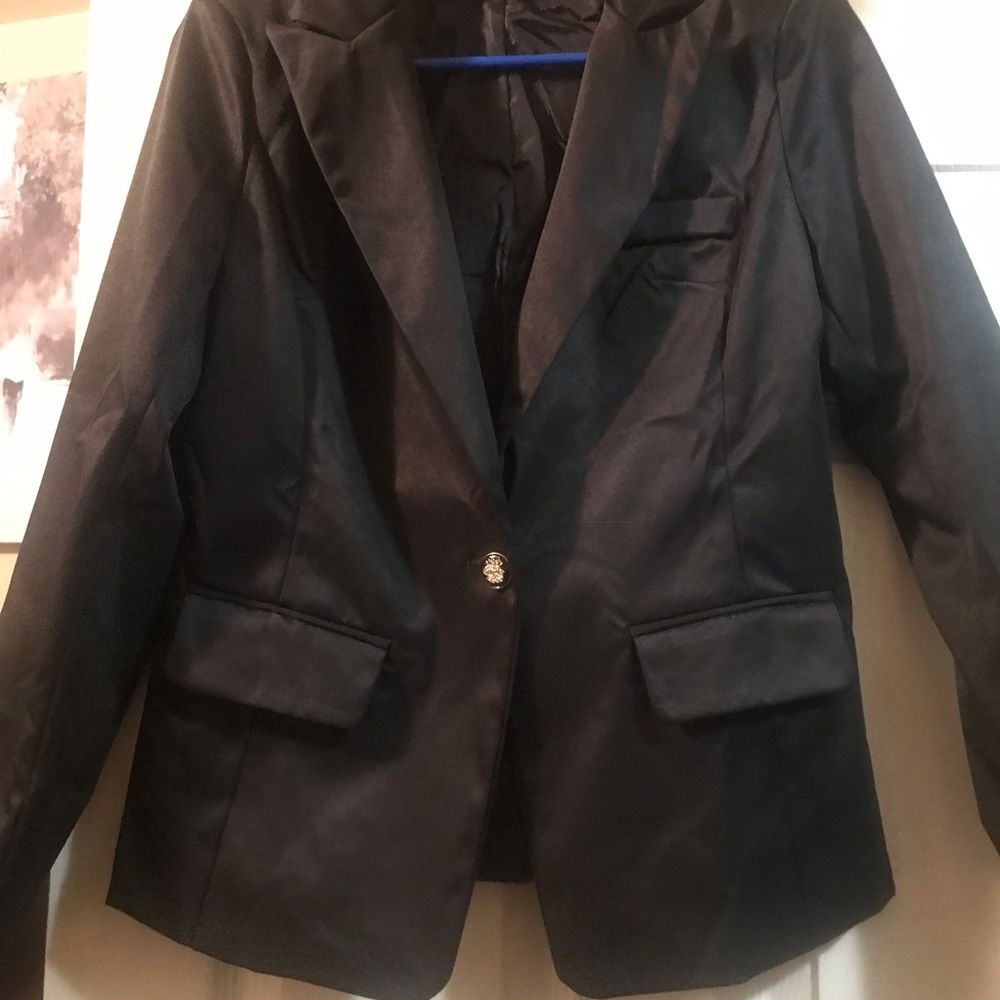 Woman’s fitted dress or office  jacket.